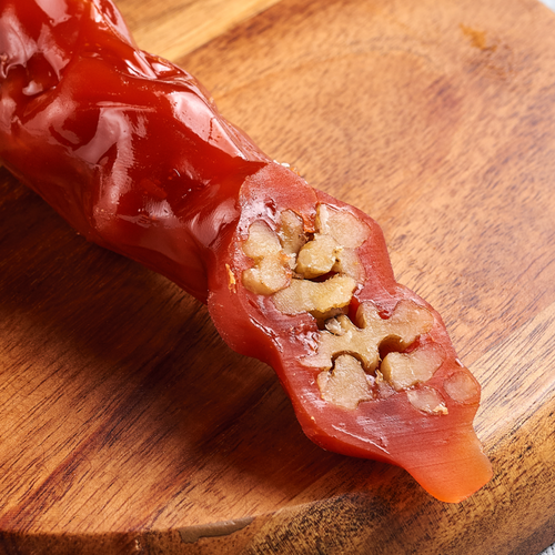 Sweet sujukh with walnuts and apricot flavor